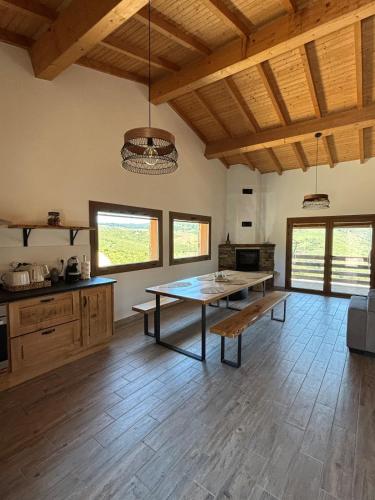 a large kitchen with a table in the middle of a room at Casa da Tapada Santo Antonio in Branda de Santo António
