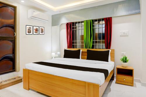 Ένα ή περισσότερα κρεβάτια σε δωμάτιο στο Hotel O Sagar Luminoire Hotel & Banquet Hall