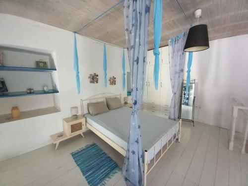 En eller flere senge i et værelse på Azul And The Blue Maisonette