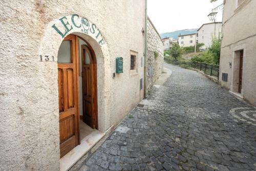 an entrance to a building with a door on a street at Le Coste in Villetta Barrea