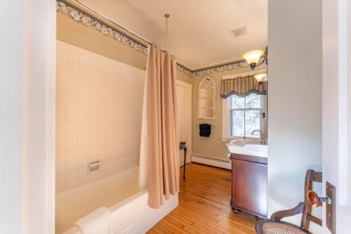 a bathroom with a tub and a sink and a shower at Dominion Hill Country Inn in Bocabec