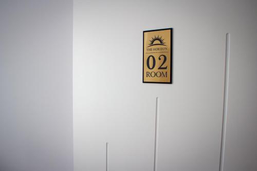 a door with a room sign on it at The Horizon in Berat