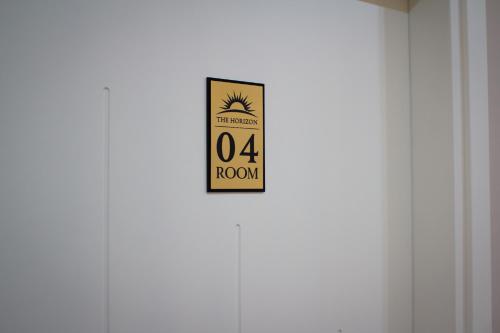a sign on the door of a room at The Horizon in Berat
