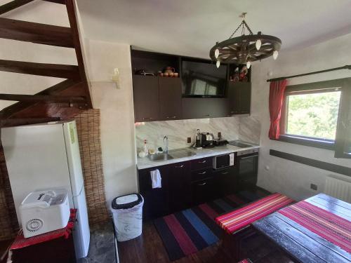 En eller flere senge i et værelse på Къща за гости Дядо Яни