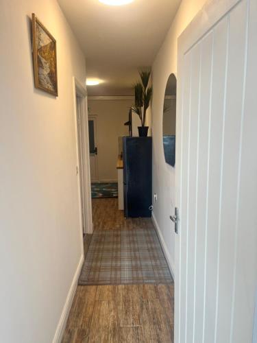 a hallway with a hallway leading to a room at Bacton Coastal Retreat in Bacton