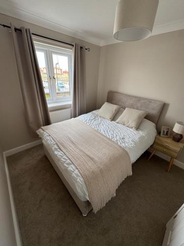 Ένα ή περισσότερα κρεβάτια σε δωμάτιο στο Hartlepool Marina View Apartment