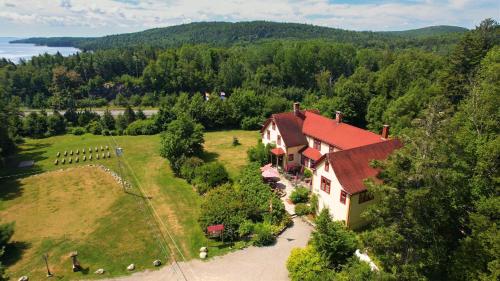 an aerial view of a house in a field at Dominion Hill Country Inn in Bocabec