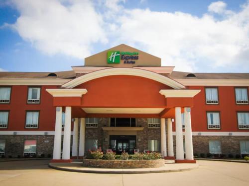 a large red building with a hilton hotel at Holiday Inn Express & Suites Nacogdoches Southwest by IHG in Nacogdoches