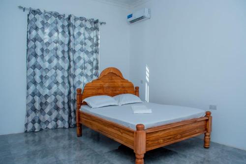 Giường trong phòng chung tại 2-Bedroom Villa in Nungwi