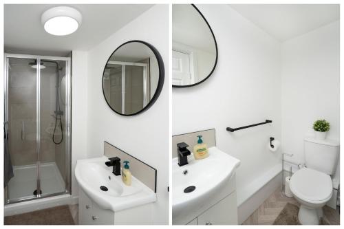 リンカーンにあるStudio in Lincolnの洗面台と鏡付きのバスルームの2枚