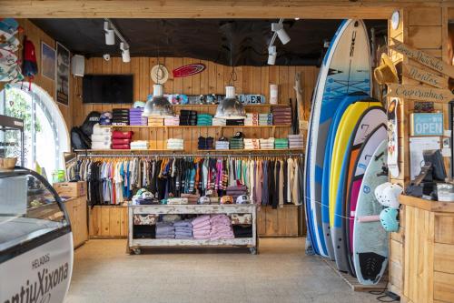 a store with surfboards in a room with sidx sidx sidx at La Surfería Suances in Suances