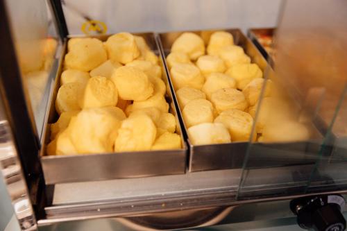 a group of trays of food in a toaster oven at Hotel Bergozza in Rio do Sul