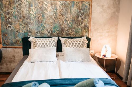 a bed with two pillows in a bedroom at Uroczysko Oleśnica in Chodzież