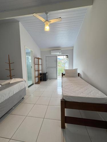 Postel nebo postele na pokoji v ubytování Pousada Vila Coral