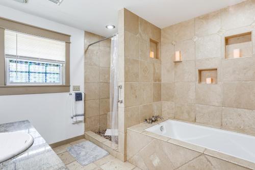 a bathroom with a tub and a toilet and a sink at Relaxing Outdoor Spaces Quiet Wooded Gem in Hardy in Hardy