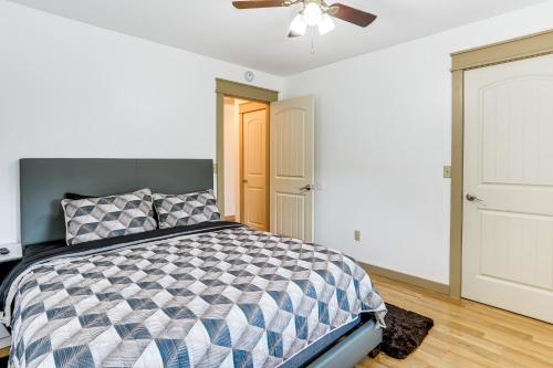 a bedroom with a bed and a ceiling fan at Relaxing Outdoor Spaces Quiet Wooded Gem in Hardy in Hardy
