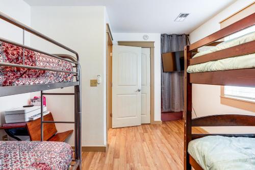 a small room with two bunk beds and a door at Relaxing Outdoor Spaces Quiet Wooded Gem in Hardy in Hardy