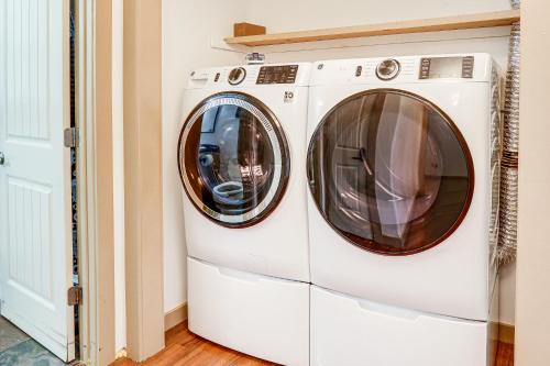 two washing machines sitting next to each other in a room at Relaxing Outdoor Spaces Quiet Wooded Gem in Hardy in Hardy