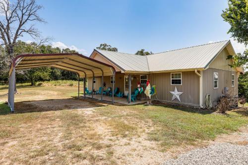 a house with a gambrel roof and a playground at Relaxing Outdoor Spaces Quiet Wooded Gem in Hardy in Hardy