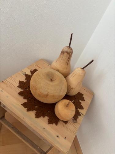 a group of mushrooms sitting on top of a wooden table at Apart Pitzenklamm in Arzl im Pitztal