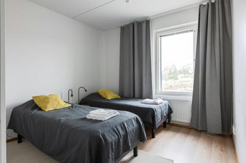 Ένα ή περισσότερα κρεβάτια σε δωμάτιο στο Spacious Apartment for 4
