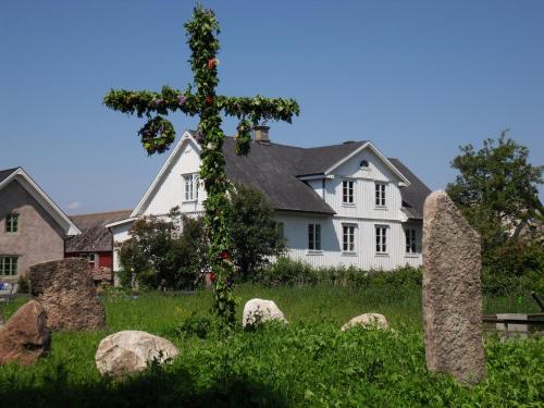 a house with a cross in front of it at Mellby Ör Inn in Mellby