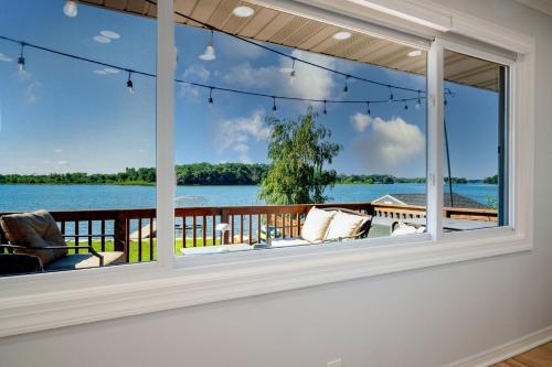 a room with a window with a view of the water at 3Bed 2Bath Luxury Lake House on Myers Bay Private Pier Beach Firepit and Deck in Fox Lake