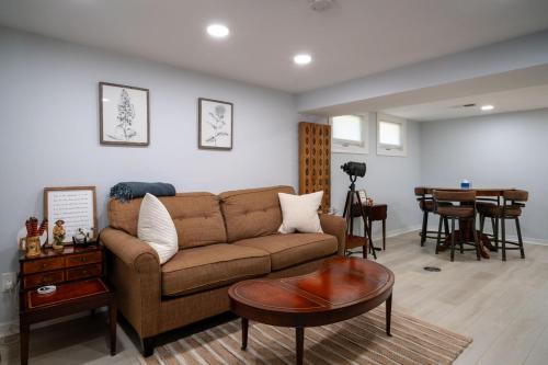 a living room with a couch and a table at 3Bed 2Bath Luxury Lake House on Myers Bay Private Pier Beach Firepit and Deck in Fox Lake