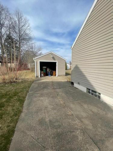 a garage with a door open on a house at Duncan Enterprise Homes in Akron