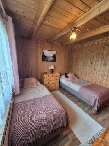 U Parów Sauna & Jacuzziにあるベッド