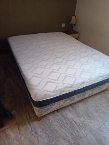 a mattress sitting on a bed in a room at el escondido in Villa Cura Brochero