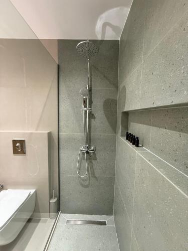 a bathroom with a shower and a sink at Theros Residence in Stavros