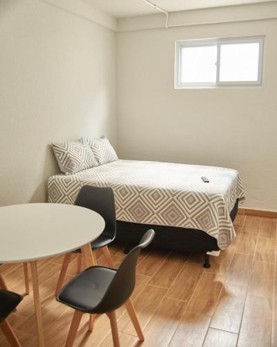 Ένα ή περισσότερα κρεβάτια σε δωμάτιο στο Apartment Studio in the Historic Center