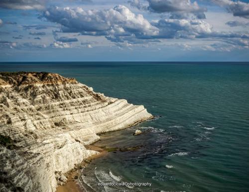 an aerial view of the ocean and a rocky cliff at Scala dei Turchi Apartment in Realmonte