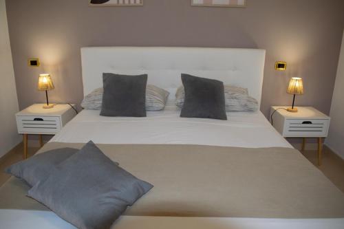 Un ou plusieurs lits dans un hébergement de l'établissement B&B Feni