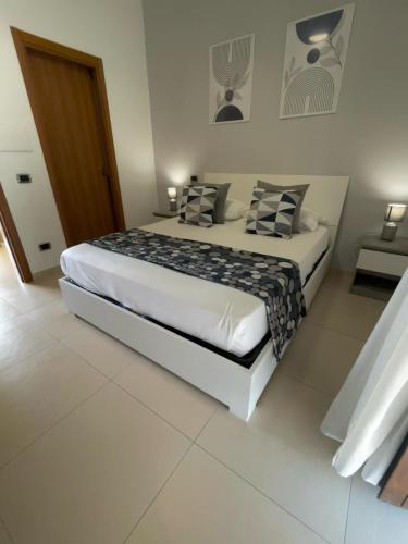 Un ou plusieurs lits dans un hébergement de l'établissement B&B Feni