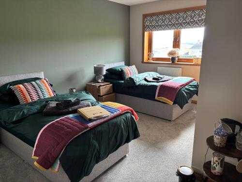 Katil atau katil-katil dalam bilik di Tigh an Fhearainn B&B Low Road Portskerra Melvich Thurso KW14 7YL