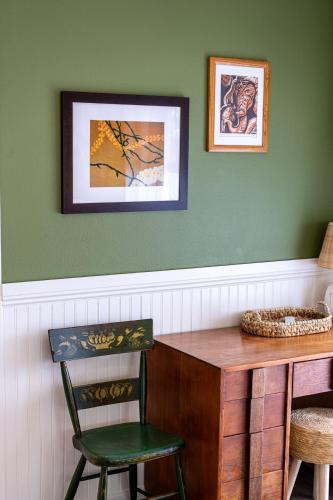 a room with a wooden desk and a chair at Stylized Captain's House in Captain Cook