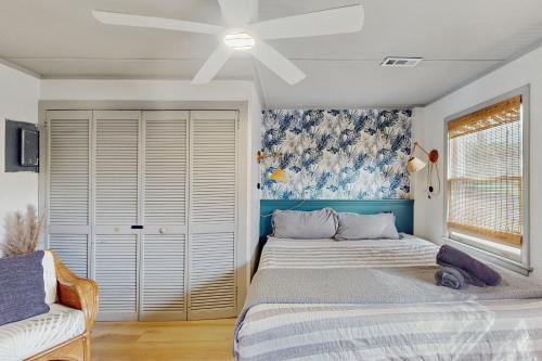 a bedroom with two beds and a ceiling fan at Entire House - Serenity in Surf City in Surf City