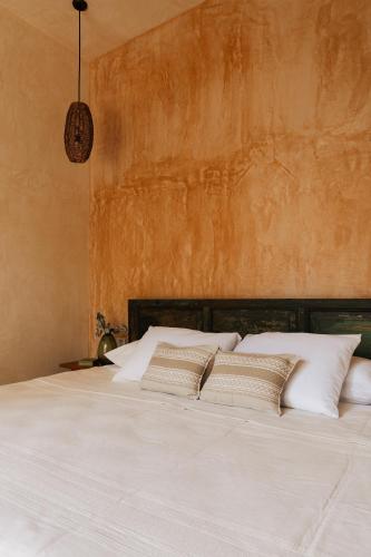 Ένα ή περισσότερα κρεβάτια σε δωμάτιο στο Casa Hotel Izkina