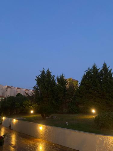 a view of a park at night with lights at Casa StefanoS in Afitos