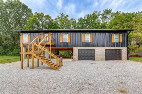 a house with a staircase in front of a garage at Relax on the River Modern Mountain View Escape! in Mountain View