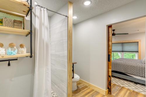 a bathroom with a shower and a toilet in a room at Relax on the River Modern Mountain View Escape! in Mountain View