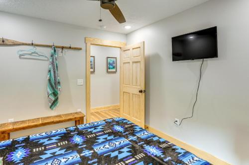 a bedroom with a bed and a flat screen tv at Relax on the River Modern Mountain View Escape! in Mountain View