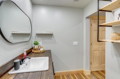 a bathroom with a sink and a mirror at Relax on the River Modern Mountain View Escape! in Mountain View