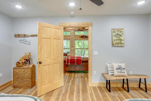 a room with a wooden door and a table at Relax on the River Modern Mountain View Escape! in Mountain View