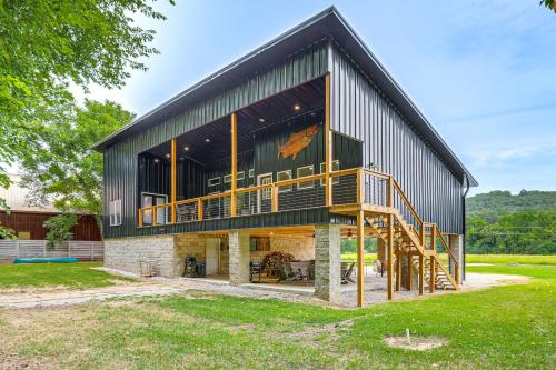 a large metal building with a large deck at Relax on the River Modern Mountain View Escape! in Mountain View