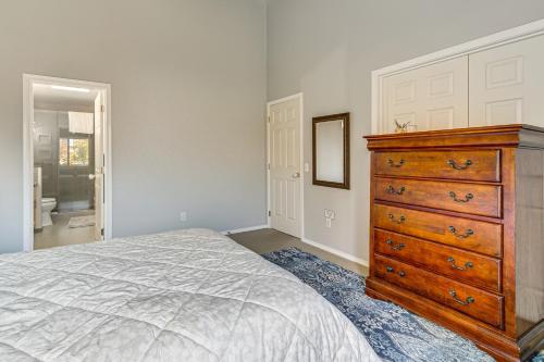a bedroom with a wooden dresser and a bed at Modern Home Close to Dtwn Woodinville with Yard in Woodinville