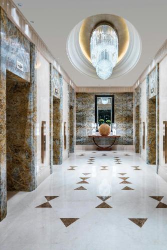 a lobby with a large ceiling with a chandelier at The St. Regis Chengdu in Chengdu