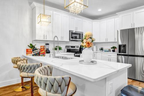 a kitchen with white cabinets and a white counter top at Spacious 7 Bed Home Near Downtown in Atlanta